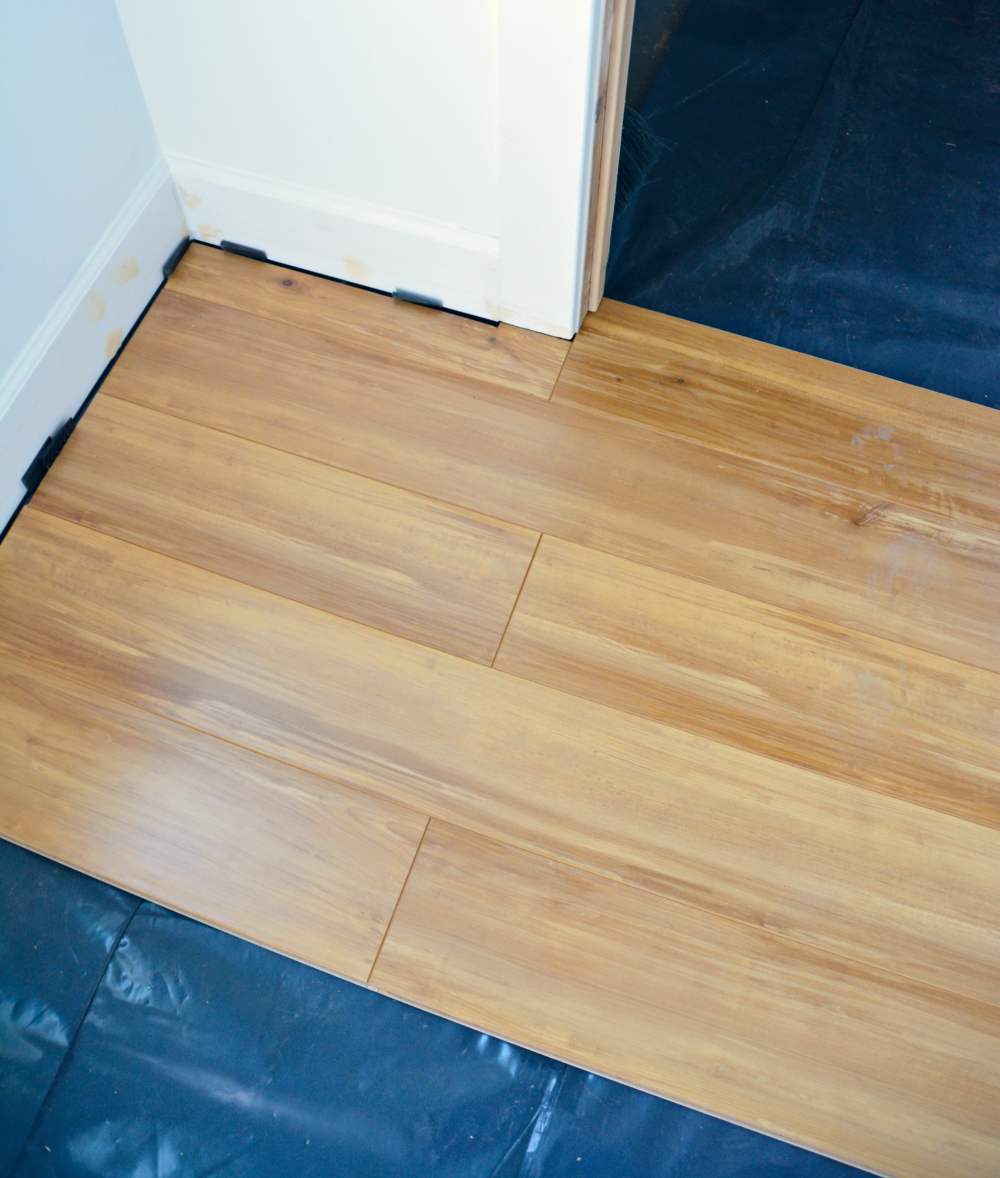 Install Laminate Flooring Over Concrete, Can You Glue Laminate Flooring To Concrete Wall